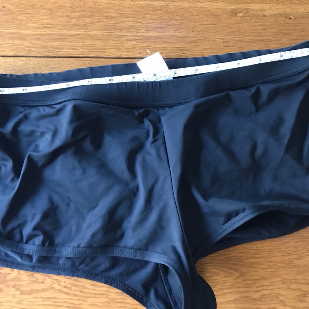 Calvin Klein boy short swim bottom, black, size medium.